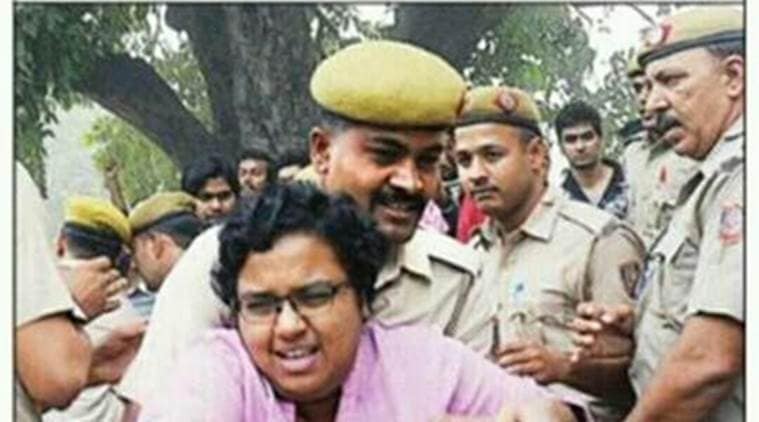 This picture of a JNU student being manhandled by the cop is being massively shared on social media/ Twitter