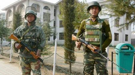 Srinagar: Security personnel stand guard at the head-office of Jammu and Kashmir State Board of School Education (BOSE), in Srinagar on Thursday. BOSE is going to conduct annual examinations of Secondary (10th) and Higher Secondary (12th) classes despite the ongoing unrest in valley with the reducation of 50% in syllabus. PTI Photo  (PTI11_3_2016_000205A)