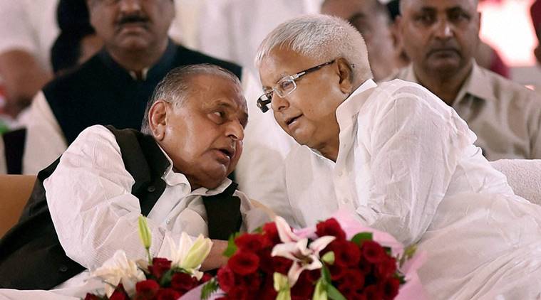 Lucknow: Samajawdi Party supremo Mulayam Singh Yadav sharing a thought with RJD chief Lalu Prasad Yadav during the Samajwadi Party's 25th Foundation Day celebrations in Lucknow on Saturday. PTI Photo by Nand Kumar(PTI11_5_2016_000142b)