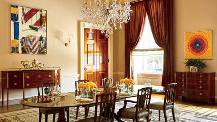 This photo provided by Architectural Digest show the Old Family Dining room in the White House in Washington. Works by Robert Rauschenberg, right, and Alma Thomas, the first African American artist woman represented in the White House, left, make a modern splash. President Barack Obama likes to say the White House is the “people’s house.” Exclusive photos published by Architectural Digest are giving the public its first glimpse of private areas on the second floor of the White House that Obama, his wife, Michelle, daughters Malia and Sasha and family dogs Bo and Sunny have called home for nearly eight years.(Michael Mundy/Architectural Digest via AP)