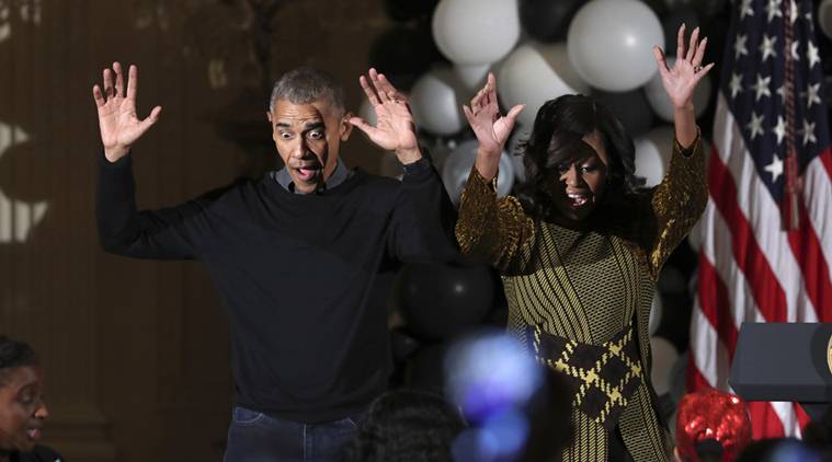 President Barack Obama and the first lady Michelle Obama dance to the beat of Michael Jackson's "Thriller" at they welcome children from Washington area and children of military families to trick-or-treat celebrating Halloween at the White House in Washington, Monday, Oct. 31, 2016. (AP Photo/Manuel Balce Ceneta)