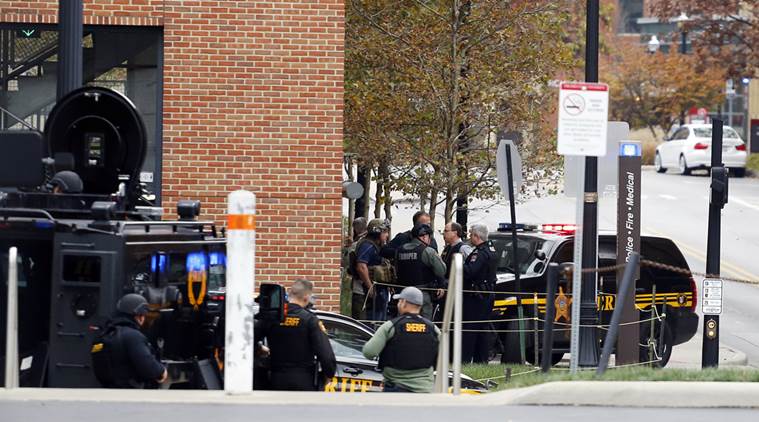 Law enforcement officers work around a parking garage in response to an attack on the campus of Ohio State University on Monday, Nov. 28, 2016, in Columbus, Ohio. (AP Photo/Jay LaPrete)