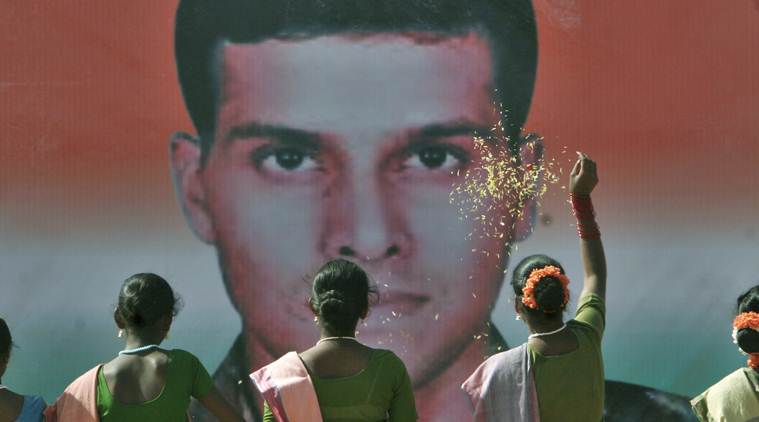 School children pay floral tributes to Major Sandeep Unnikrishnan of the National Security Guard who was killed in the Mumbai terror attacks.