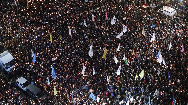 Protesters march toward presidential house after a rally calling for South Korean President Park Geun-hye to step down in Seoul, South Korea. (AP Photo/Ahn Young-joon, File)