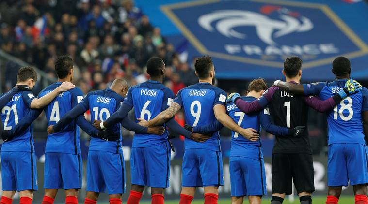 France's players stand together during a minute of silence to pay tribute to the victims, one year after a series of attacks at several sites in Saint-Denis and Paris, before their Group A 2018 World Cup Qualifying European Zone match at the Stade de France in Saint-Denis, near Paris, France, November 11, 2016. REUTERS/Benoit Tessier