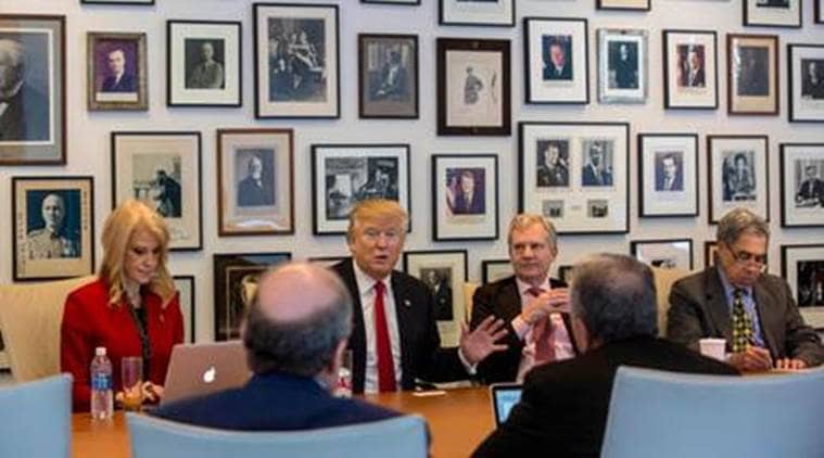 Kellyanne Conway, from left, President-elect Donald Trump, New York Times Publisher Arthur Sulzberger Jr., and vice chairman of The New York Times Company Michael Golden appear during a meeting with editors and reporters at The New York Times building, Tuesday, Nov. 22, 2016 in New York. (Hiroko Masuike/The New York Times via AP)