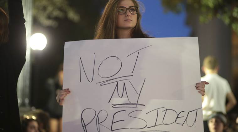 Anna Thornton participates in a protest in opposition of Donald Trump's presidential election victory, Wednesday, Nov. 9, 2016, in Athens, Ga. "I fear we're going to lose all of the rights we've gained when Trump takes office," said Thornton. (John Roark/Athens Banner-Herald via AP)
