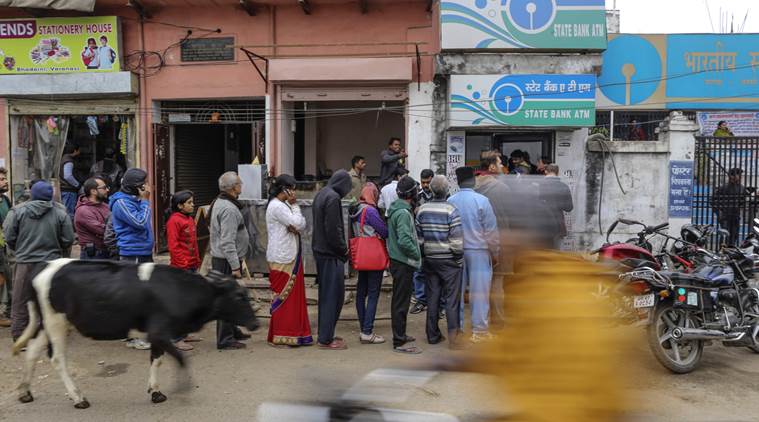 Customers wait in queue at Sate Bank of India ATM in Varanasi, Uttar Pradesh, India, on Friday, Dec. 9, 2016. Photographer: Dhiraj Singh/Bloomberg