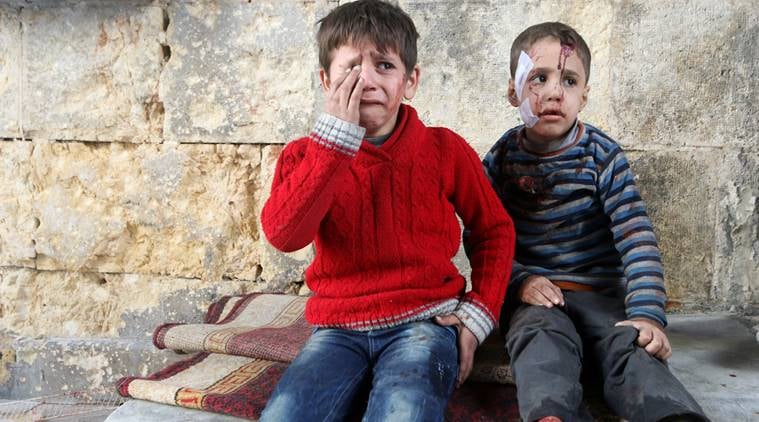Injured boys react at a field hospital after airstrikes on the rebel held areas of Aleppo, Syria November 18, 2016. REUTERS/Abdalrhman Ismail