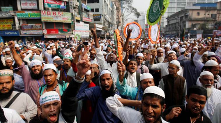 Bangladeshi Muslim activists of an Islamic group shout slogans as they gather in front of Baitul Muqarram National Mosque to protest against the deaths of Rohingya Muslims in the Rakhine state of Myanmar, in Dhaka, Bangladesh, December 18, 2016. REUTERS/Mohammad Ponir Hossain