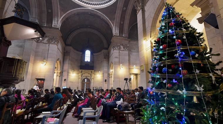 New Delhi: Devotees offer prayers on the occasion of Christmas at the Cathedral Church of the Redemption in New Delhi on Sunday. PTI Photo by Shahbaz Khan(PTI12_25_2016_000017A)