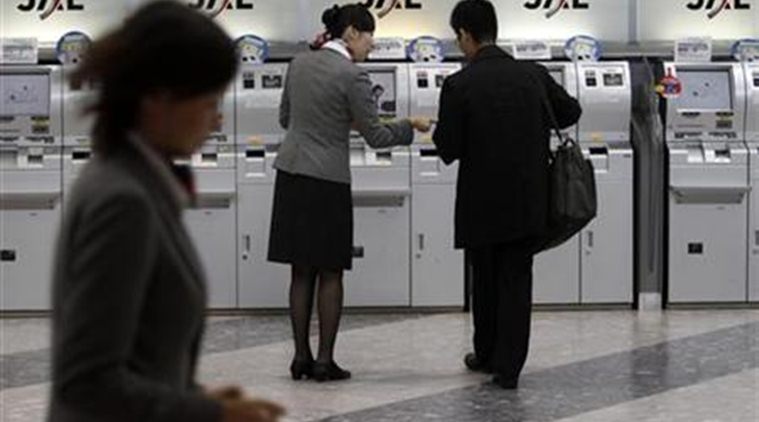 japan, japan snowfall, japan airport, japan airport snowfall, japan snow, japan christmas, world news, indian express
