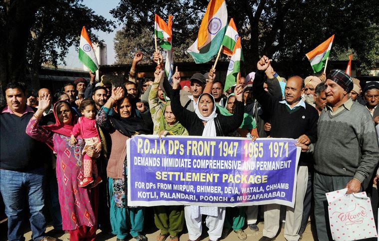 Jammu : Pakistan occupied Kashmir (PoK) refugees shouting slogans during a protest for their various demands in Jammu on Tuesday. PTI Photo   (PTI12_20_2016_000138B)