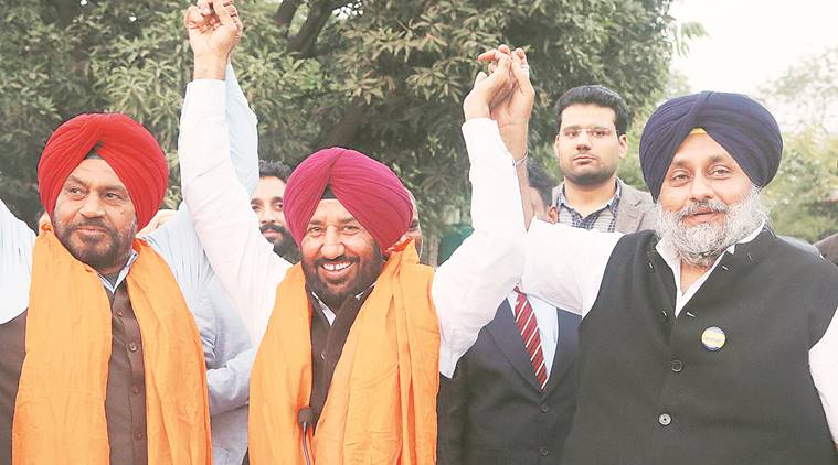 Sibia (centre) with Sukhbir Badal (right) after joining SAD, in Chandigarh on Saturday. Jasbir Malhi