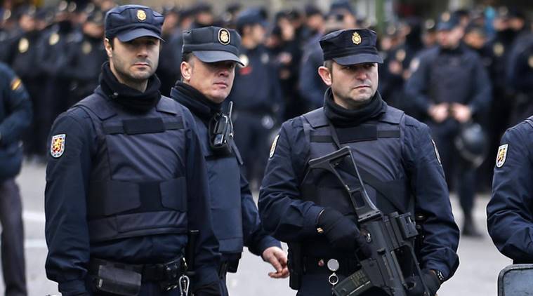 Police stand outside Real Madrid's Santiago Bernabeu stadium in Madrid, Spain, Saturday, Nov. 21, 2015.  Unprecedented security measures are in place for the first clasico of the season between Real Madrid and Barcelona, with nearly 3,000 policemen and private security officers dispatched to guarantee public safety at the Santiago Bernabeu stadium in Madrid. (AP Photo/Paul White)