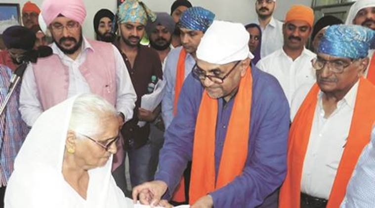 Compensation distribution to victims of 1984 Anti Sikh Riots in Gurgaon by Chairperson of National Minorities Commission. Express photo
