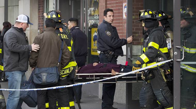 An injured passenger is carried out of Atlantic Terminal on a gurney by firefighters after a Long Island Rail Road incident, Wednesday, Jan. 4, 2017, in the Brooklyn borough of New York. Officials said a commuter train either hit something or derailed as it arrived at the terminal. (AP Photo/Mark Lennihan)