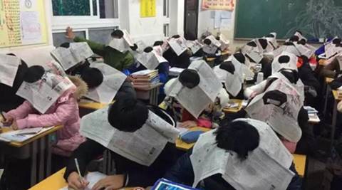 cheating students china, anti cheating newspaper hats students china, anti cheating device china, china cheating students, school anti cheating china, indian express, indian express news
