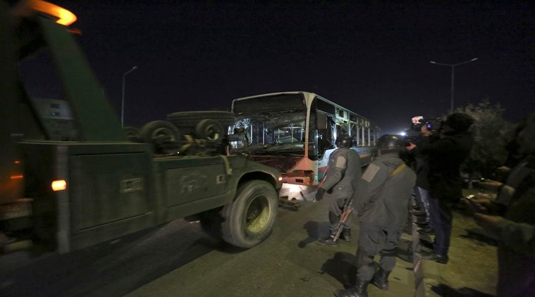 Afghan security forces remove a damaged vehicle after two large bombings in Kabul, Afghanistan, Tuesday, Jan. 10, 2017. Two loud explosions rocked the Afghan capital of Kabul, causing casualties. The target of the blasts was probably an area that includes government and lawmakers' offices. Sediq Sediqqi, spokesman for the Interior Ministry, said that first, a suicide bomber carried out an attack, followed by a second explosion, caused by car bomb parked near the site. (AP Photo/Rahmat Gul)