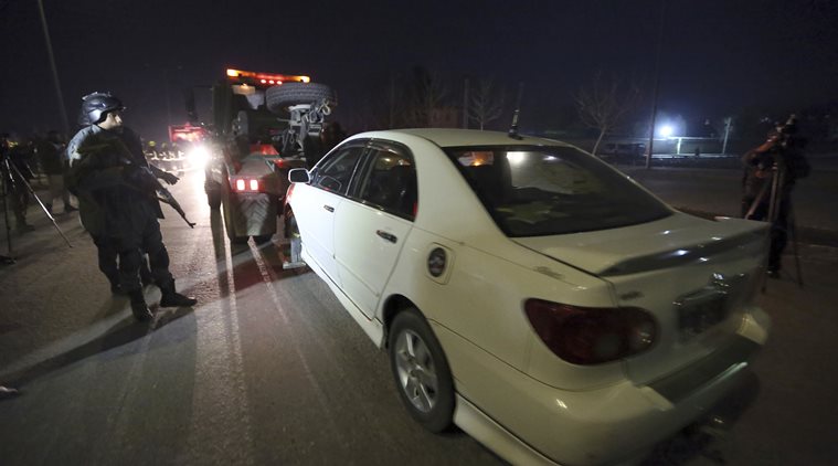 Afghan security forces remove a damaged vehicle after of two large bombings in Kabul, Afghanistan, Tuesday, Jan. 10, 2017. Two loud explosions have rocked the Afghan capital of Kabul, causing casualties. The target of the blasts was probably an area that includes government and lawmakers' offices. Sediq Sediqqi, spokesman for the Interior Ministry, said that first, a suicide bomber carried out an attack, followed by a second explosion, caused by car bomb parked near the site. (AP Photo/Rahmat Gul)