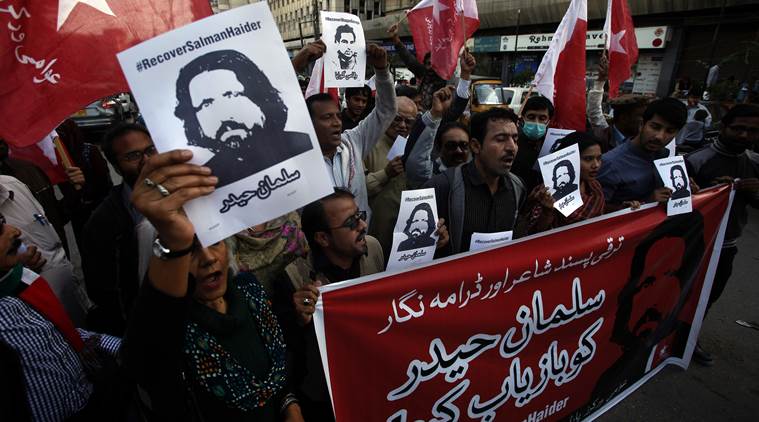 Supporters of Awami Worker Party hold a demonstration to condemn the missing human rights activists, in Karachi, Pakistan, Tuesday, Jan. 10, 2017. International and local rights groups on Tuesday urged the Pakistani government to investigate the abductions last week of four anti-Taliban activists — disappearances that critics claim reflect a crackdown on secular dissent. (AP Photo/Fareed Khan)