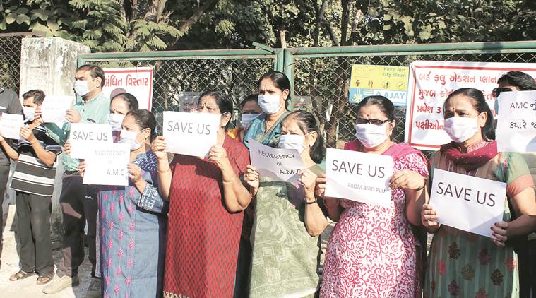 Residents of Memnagar protest burial of culled birds in the area. (Express Photo Javed Raja) 