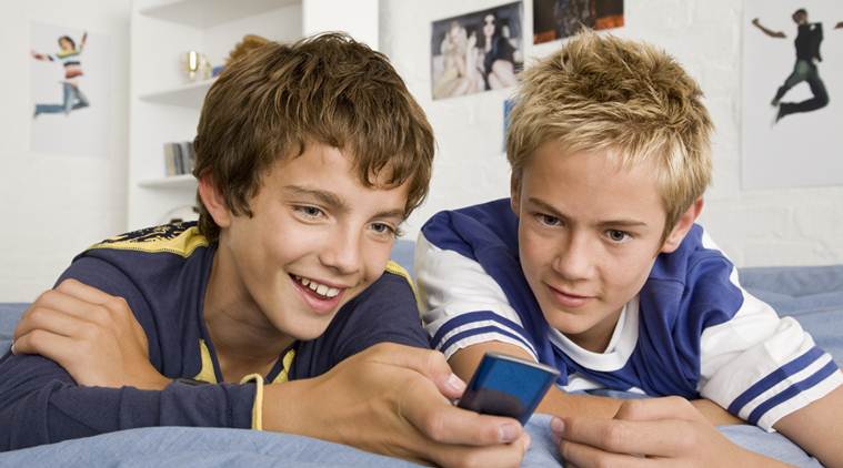 Teenager, teenage boys, social media, teens social media, social media teens, social media addiction, children social media addiction, social media studies, social media side effects, social media sleep, lifestyle news, indian express