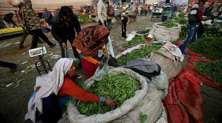 Two female Local Vegetables vendors purchase vegetables from Ghazipur whole sale market after demonetization in New Delhi. EXPRESS PHOTO BY PRAVEEN KHANNA 04 01 2017.