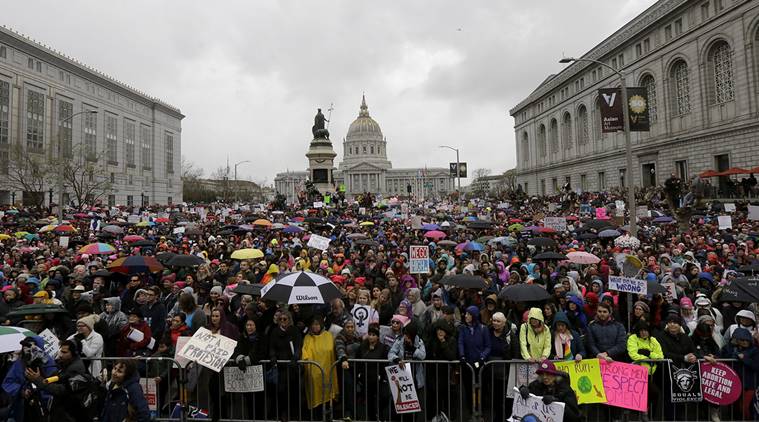 A crowd listens to speakers a rally near City Hall before a women's march during the first full day of Donald Trump's presidency in San Francisco, Saturday, Jan. 21, 2017. (AP Photo/Jeff Chiu)