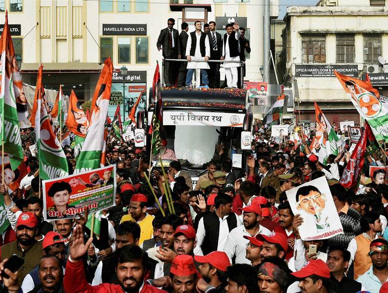 Lucknow: Uttar Pradesh Chief Minister and newly appointed party president Akhilesh Yadav with Congress Vice President Rahul Gandhi in a road show in Lucknow on Sunday. PTI Photo by Nand kumar(PTI1_29_2017_000143B)