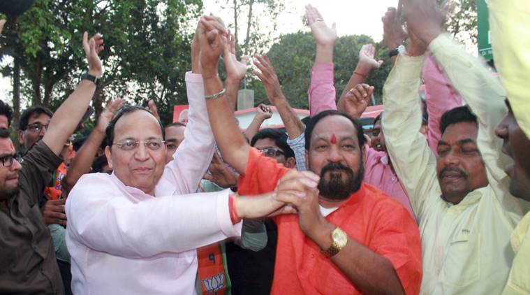 Vijay Utsav at BJP office. State BJP chief Basant Panda(in red) celebrating with general secretary in-charge of Odisha, Arun Singh. (Express Photo)