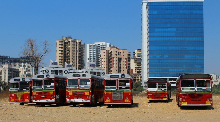 Buses parked on election duty near a distribution center in Andheri sport complex for upcoming Bmc Election on Monday. Express Photo By Santosh Parab 20/02/2017