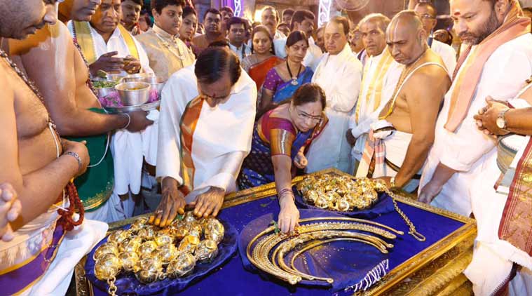 KCR, along with his wife, making offering in Tirupati. (Express Photo)