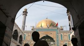 Devotees are silhouetted as they gather at the tomb of Sufi saint Syed Usman Marwandi, also known as the Lal Shahbaz Qalandar shrine, after Thursday’s suicide blast, in Sehwan Sharif dama dam mast qalandar, Jhulelal song, Sehwan Sharif, Sindhi Pakistani, Indian express news