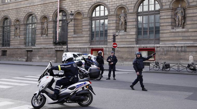 Police officers cordon off the area next to the Louvre museum in Paris,Friday, Feb. 3, 2017. Paris police say a soldier has opened fire outside the Louvre Museum after he was attacked by someone, and the area is being evacuated. (AP Photo/Thibault Camus)