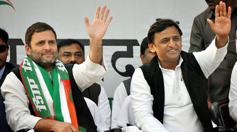 Kanpur: Congress Vice President Rahul Gandhi and UP Chief Minister Akhilesh Yadav wave to the crowd at a public rally in Kanpur on Sunday. PTI Photo(PTI2_5_2017_000214B)