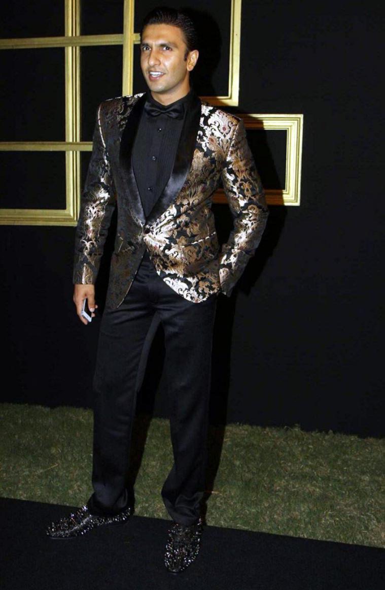 Ranveer Singh in a black and gold brocade blazer.