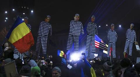 Protesters hold effigies with the faces of leader of Romania's leftist Social Democrat Party (PSD) Liviu Dragnea and other members of the party dressed as prisoners, during a demonstration in Bucharest, Romania, February 5, 2017. REUTERS/Stoyan Nenov