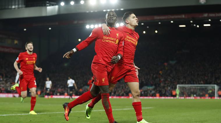 Britain Soccer Football - Liverpool v Tottenham Hotspur - Premier League - Anfield - 11/2/17 Liverpool's Sadio Mane celebrates scoring their second goal with Philippe Coutinho Action Images via Reuters / Carl Recine Livepic EDITORIAL USE ONLY. No use with unauthorized audio, video, data, fixture lists, club/league logos or "live" services. Online in-match use limited to 45 images, no video emulation. No use in betting, games or single club/league/player publications. Please contact your account representative for further details.