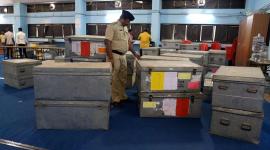 A policeman guards Electronic Voting Machines EVM, voting machine, Aam aadmi party, election commission, EVM tampering, voting machine tampering, electronic voting machines, EVM controversy, delhi, india, indian express