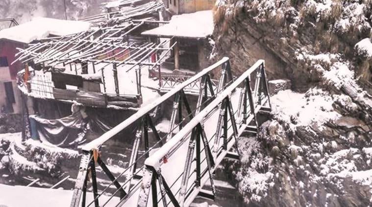 the Yamunotri shrine, at a height of 10,800 ft. One of the sadhus here says he hasn’t crossed the bridge to climb down in several decades. (Source: Express photo by Ashutosh Bhardwaj)
