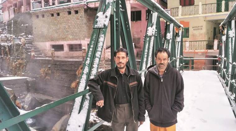 Virendra Rawat (left) and Kesar Singh Rawat, a disciple and sadhu at Yamunotri shrine. Unless snow stops them, they say they will trek down 6 km to vote. (Source: Express photo by Ashutosh Bhardwaj)