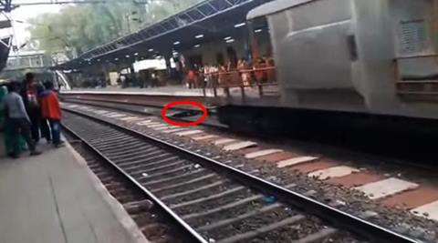 woman under train video, shocking train video, train video, woman under train alive, youtube trending, trending videos, india viral videos, india train videos, train videos india, train runs over living girl, indian express, indian express trending, trending in india