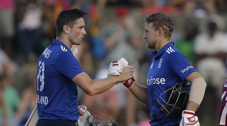 England's batsmen Chris Woakes, left, and Joe Root celebrates defeating West Indies by four wickets during their second one day international cricket match at the Sir Vivian Richards Stadium in North Sound, Antigua, Sunday, March 5, 2017. (AP Photo/Ricardo Mazalan)