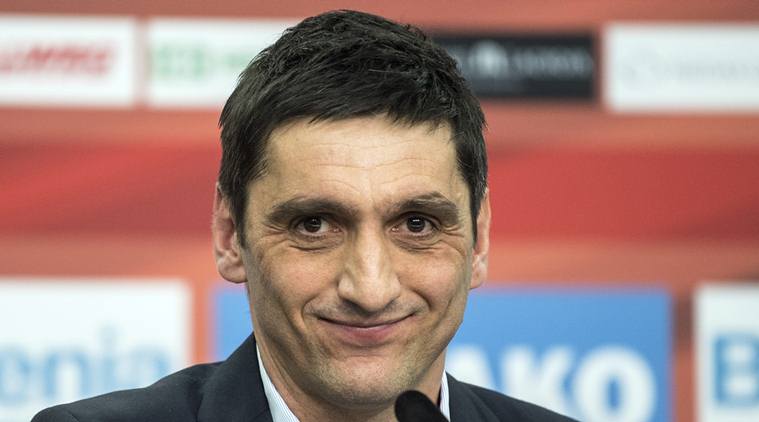 Leverkusen's new interim coach, Tayfun Korkut attends a news conference in Leverkusen, Germany, Monday March 6, 2017. After the club sacked Roger Schmidt on Sunday, Korkut was presented as interim coach on Monday. (Federico Gambarini/dpa via AP)