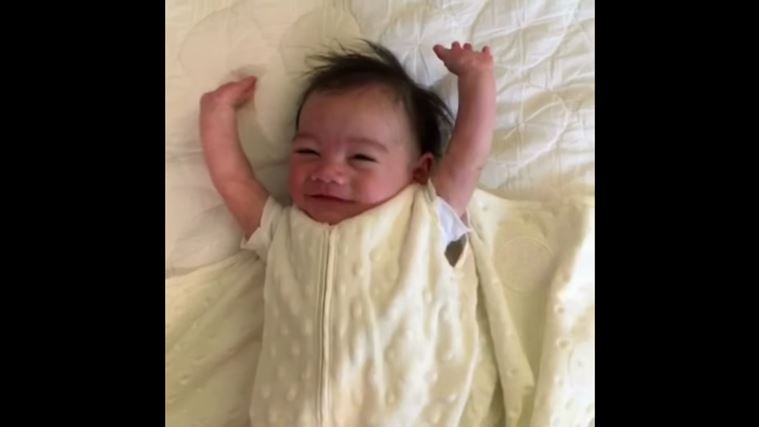 WATCH Cute Baby Throws Up Hands In Air After Being Swaddled In Viral Video Trending News The 