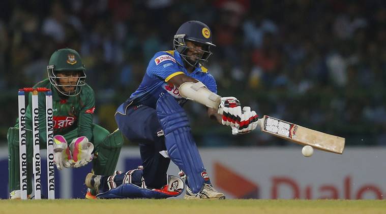 Sri Lanka's Dilshan Munaweera leaves the field after dismissal