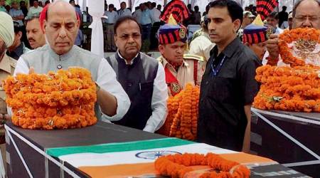 Raipur: Union Home Minister Rajnath Singh paying tribute to CRPF jawans killed in the naxal attack in Chhattisgarh's Sukma district, in Raipur on Tuesday. PTI Photo/ Twitter(PTI4_25_2017_000024A)