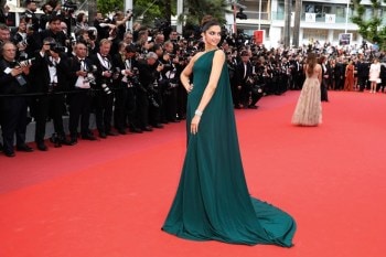 Wearing a green gown by Brandon Maxwell at the 2017 Cannes Film