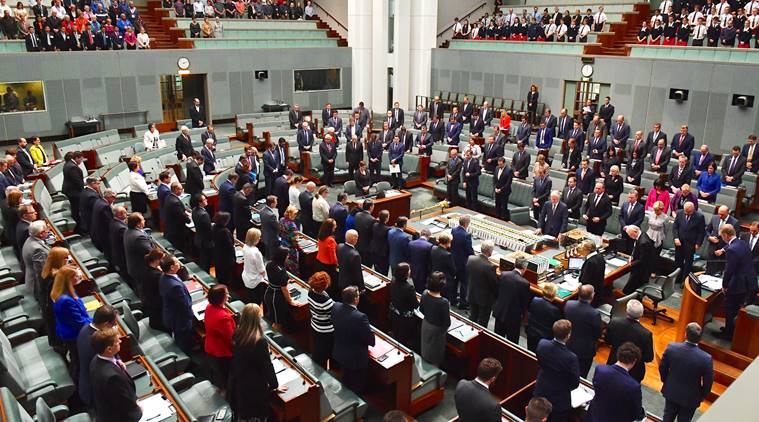 Australian Parliamentarians stand for a minute of silence honouring the people killed and wounded in an explosion in the English city of Manchester during Question Time in the House of Representatives at Parliament House in Canberra, Australia May 23, 2017. AAP/Mick Tsikas/via REUTERS    ATTENTION EDITORS - THIS IMAGE WAS PROVIDED BY A THIRD PARTY. EDITORIAL USE ONLY. NO RESALES. NO ARCHIVE. AUSTRALIA OUT. NEW ZEALAND OUT.